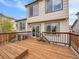 Inviting outdoor wooden deck with stairs and railing perfect for relaxing and entertaining at 6343 Laguna Cir, Highlands Ranch, CO 80130