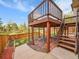 Inviting backyard deck featuring a two-tiered layout and a well-maintained wood fence, perfect for outdoor entertaining at 6343 Laguna Cir, Highlands Ranch, CO 80130