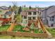 Aerial view of the backyard featuring a spacious lawn, privacy fence, and a wooden deck at 6343 Laguna Cir, Highlands Ranch, CO 80130