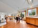 Charming dining area featuring wood floors, natural light, and views to other living spaces at 6343 Laguna Cir, Highlands Ranch, CO 80130