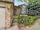 Inviting front entrance with brick accents, manicured bushes, and ADT security system at 6343 Laguna Cir, Highlands Ranch, CO 80130