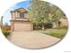Charming two-story home featuring an attached two-car garage, and a well-manicured lawn at 6343 Laguna Cir, Highlands Ranch, CO 80130