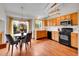Bright eat-in kitchen features black appliances, and ample cabinet space at 6343 Laguna Cir, Highlands Ranch, CO 80130
