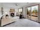 Cozy living room boasts a fireplace, plush seating, and sliding doors to the outdoor deck at 6343 Laguna Cir, Highlands Ranch, CO 80130