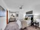 Spacious bedroom with a ceiling fan, carpet, and a window providing natural light at 6343 Laguna Cir, Highlands Ranch, CO 80130