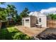 Cozy backyard featuring a patio, small lawn, and privacy fence perfect for outdoor entertaining at 4450 S Fox St, Englewood, CO 80110