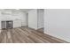 Finished basement space with vinyl flooring, a wine fridge, and lots of extra storage space at 4450 S Fox St, Englewood, CO 80110