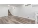 Spacious finished basement features vinyl flooring, a stairway, and great lighting at 4450 S Fox St, Englewood, CO 80110