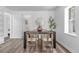 Dining area with a modern table set and sleek decor, perfect for entertaining at 4450 S Fox St, Englewood, CO 80110