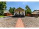 Quaint home featuring low-maintenance landscaping and a cozy covered front porch at 4450 S Fox St, Englewood, CO 80110
