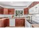 Functional kitchen with ample cabinet space and modern appliances for convenient cooking at 4450 S Fox St, Englewood, CO 80110