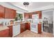Well-equipped kitchen with cabinets, appliances, and a view to the living space at 4450 S Fox St, Englewood, CO 80110