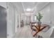 Inviting living space with a dining area, showcasing modern flooring and a cohesive design scheme at 4450 S Fox St, Englewood, CO 80110