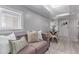 Cozy living room with a comfortable sofa, neutral decor, and bright natural light creating an inviting atmosphere at 4450 S Fox St, Englewood, CO 80110