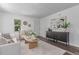 Stylishly decorated living room with elegant furniture, art, and great natural light at 4450 S Fox St, Englewood, CO 80110