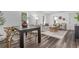Open-concept living area combining dining and living spaces for a connected feel at 4450 S Fox St, Englewood, CO 80110