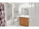 Bright bathroom featuring a shower over tub and vanity at 1283 W 112Th Ave # B, Denver, CO 80234