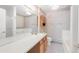 Bathroom features a large mirror, vanity with sink, and a combination tub/shower at 1283 W 112Th Ave # B, Denver, CO 80234