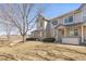 Charming two-story townhouse featuring a brick facade and well-maintained front yard at 1283 W 112Th Ave # B, Denver, CO 80234