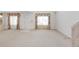 Bright and airy living room featuring neutral carpet and natural light at 1283 W 112Th Ave # B, Denver, CO 80234