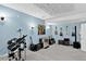Music-themed basement featuring a drum kit and guitar collection at 11208 W Ontario Ave, Littleton, CO 80127