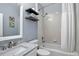 Classic bathroom design with white tiled shower-tub and framed mirror at 11208 W Ontario Ave, Littleton, CO 80127