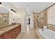 Spacious bathroom with double vanity and glass enclosed shower at 11208 W Ontario Ave, Littleton, CO 80127