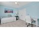 Bright bedroom features a daybed, desk, and plenty of closet space at 11208 W Ontario Ave, Littleton, CO 80127