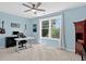 Bright bedroom features large windows, a ceiling fan, and offers space for office setup at 11208 W Ontario Ave, Littleton, CO 80127
