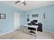 Bright bedroom features large windows, light blue walls and ample space for a desk at 11208 W Ontario Ave, Littleton, CO 80127