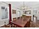 Dining room with large table, buffet and mirror at 11208 W Ontario Ave, Littleton, CO 80127