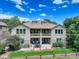 Rear view showing upper and lower patios perfect for entertaining and enjoying nature at 11208 W Ontario Ave, Littleton, CO 80127
