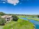 Stunning home overlooking a golf course and lake, featuring a spacious backyard and a fence at 11208 W Ontario Ave, Littleton, CO 80127