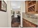 Hallway with hardwood floors leading to the dining room at 11208 W Ontario Ave, Littleton, CO 80127