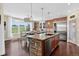 Bright and airy kitchen with large island, breakfast nook and views of the golf course at 11208 W Ontario Ave, Littleton, CO 80127