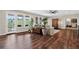 Hardwood living room with natural light and a walkout to a patio at 11208 W Ontario Ave, Littleton, CO 80127