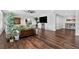 Spacious living room features hardwood floors and plenty of plants at 11208 W Ontario Ave, Littleton, CO 80127