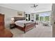 Bright main bedroom suite with sitting area, golf course views and fireplace at 11208 W Ontario Ave, Littleton, CO 80127