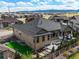 Aerial view of backyard with putting green, patio, and fire pit feature at 8023 Gore Creek Ln, Littleton, CO 80125