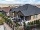 Well-maintained backyard featuring a patio with furniture, landscaping, and a fence at 8023 Gore Creek Ln, Littleton, CO 80125