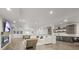 Spacious basement with a living area, fireplace, pool table, kitchenette, and modern finishes at 8023 Gore Creek Ln, Littleton, CO 80125