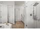 Modern bathroom featuring glass shower, tile floors, and vanity at 8023 Gore Creek Ln, Littleton, CO 80125