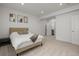 Bright bedroom featuring neutral decor, carpeted floors, and two doors leading to other rooms at 8023 Gore Creek Ln, Littleton, CO 80125