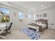 Bright and spacious bedroom with a seating area and large windows offering ample natural light at 8023 Gore Creek Ln, Littleton, CO 80125
