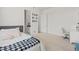 Inviting bedroom with a comfortable bed, neutral decor, and a glimpse into the en-suite bathroom, offering a serene retreat at 8023 Gore Creek Ln, Littleton, CO 80125