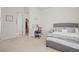 Well-lit bedroom featuring a cozy bed, a vanity area, and a view into a spacious walk-in closet, providing ample storage at 8023 Gore Creek Ln, Littleton, CO 80125