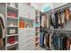 Organized walk-in closet with ample shelving and hanging space at 8023 Gore Creek Ln, Littleton, CO 80125