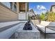 Modern outdoor fire pit with stylish seating, creating a cozy and inviting space for gatherings on the rear patio at 8023 Gore Creek Ln, Littleton, CO 80125