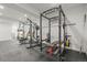Spacious home gym featuring state-of-the-art weightlifting equipment and rubber flooring at 8023 Gore Creek Ln, Littleton, CO 80125
