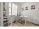 Bright home office with modern desk, comfortable chair, and natural light at 8023 Gore Creek Ln, Littleton, CO 80125